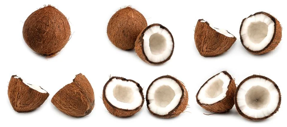 Halves of broken coconuts on a white background. Macro photo. Coconut set. Stock Photos