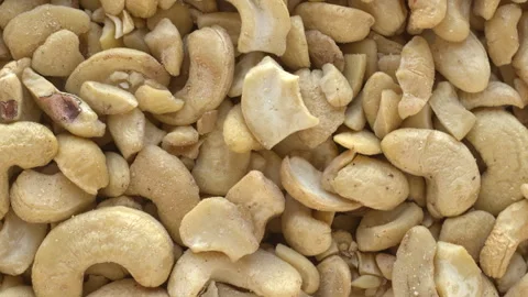 Halves of cashew nuts as background. Stock Footage 277987625