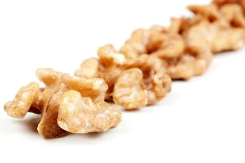 Halves peeled walnuts Stock Photos