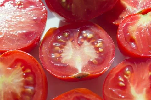 Halves tomatoes Stock Photos