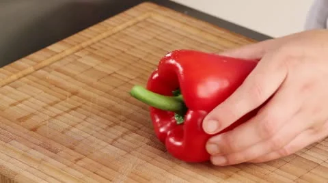 Halving and deseeding a red pepper Stock Footage 24672647