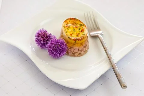 Ham and egg in aspic on a plate Stock Photos