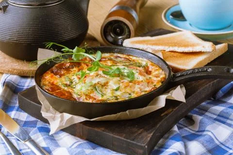 Ham and egg omelette, bio eggs, fresh herbs Stock Photos