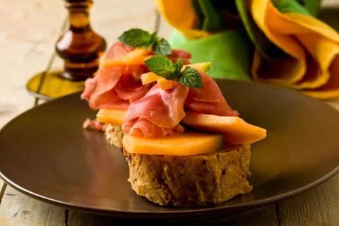 Ham and melon appetizer Stock Photos