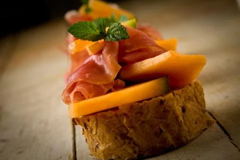 Ham and melon appetizer Stock Photos