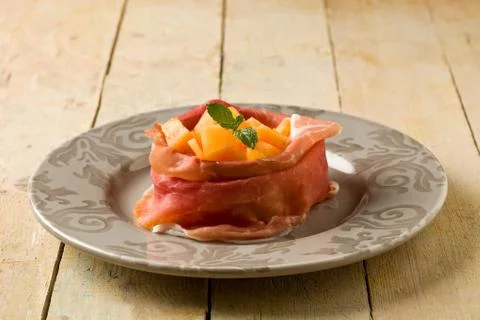 Ham and melon appetizer Stock Photos