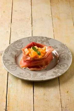 Ham and melon appetizer Stock Photos