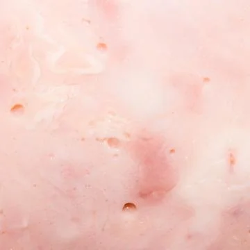 Ham background.The texture of the ham.Fresh pork ham. Stock Photos