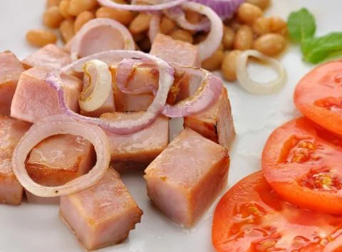 Ham with beans and tomatoes Stock Photos