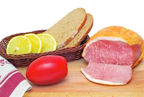 Ham , bread and vegetables on a white background. Stock Photos