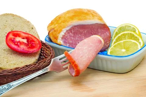 Ham , bread and vegetables on a white background. Stock Photos