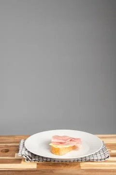 Ham on Bread on White Plate Stock Photos