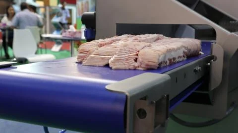 Ham on conveyor Stock Photos