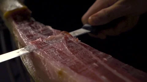 Ham cutter, cutting a piece of acorn-fed ham Stock Footage 278178002
