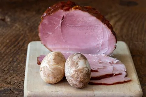 Ham on a cutting board for easter Stock Photos