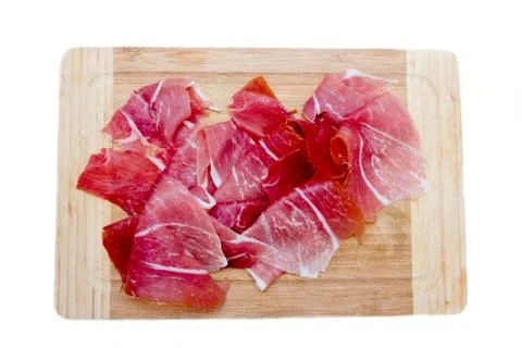 Ham on cutting board on white background seen from above Stock Photos