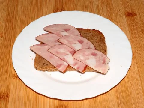 Ham on dark bread Stock Photos