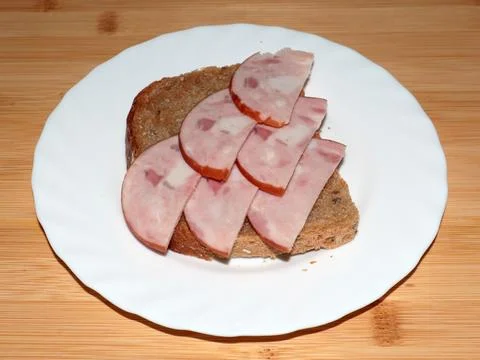 Ham on dark bread Stock Photos