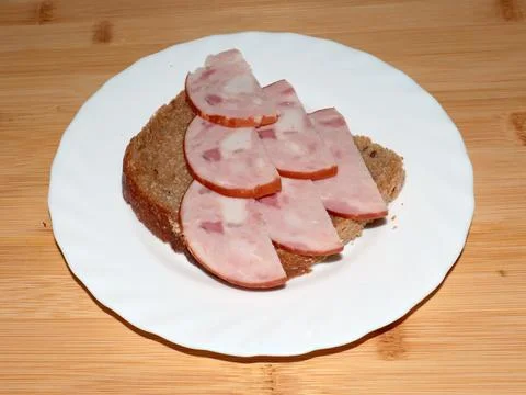 Ham on dark bread Stock Photos
