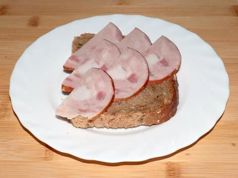 Ham on dark bread Stock Photos