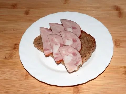 Ham on dark bread Stock Photos