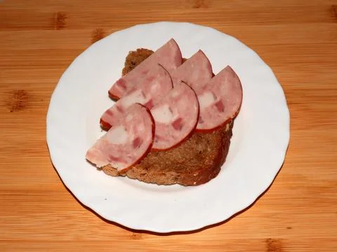 Ham on dark bread Stock Photos