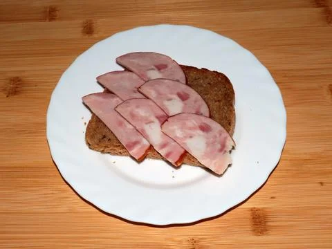 Ham on dark bread Stock Photos