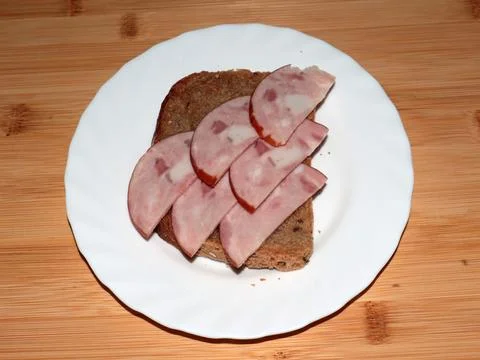 Ham on dark bread Stock Photos