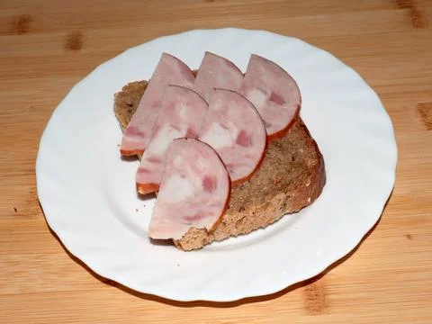 Ham on dark bread Stock Photos