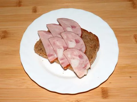 Ham on dark bread Stock Photos