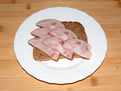 Ham on dark bread Stock Photos