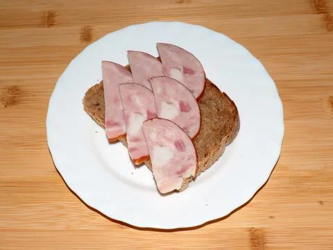 Ham on dark bread Stock Photos