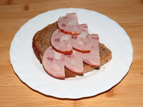 Ham on dark bread Stock Photos
