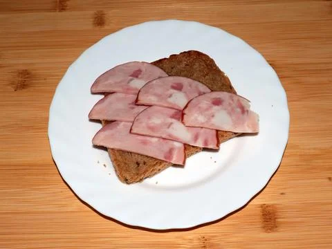 Ham on dark bread Stock Photos