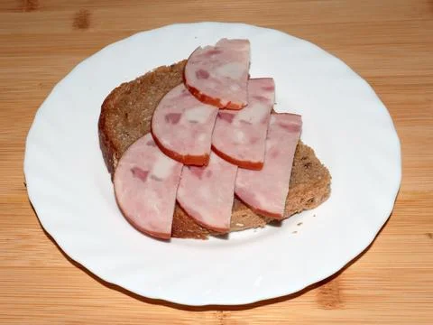 Ham on dark bread Stock Photos