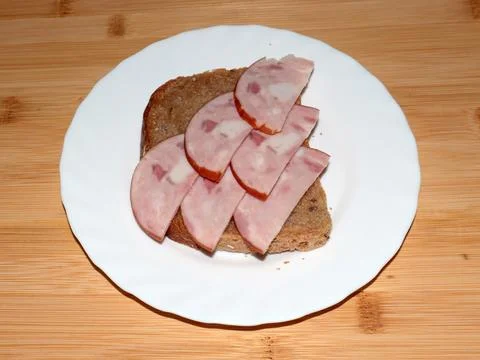 Ham on dark bread Stock Photos