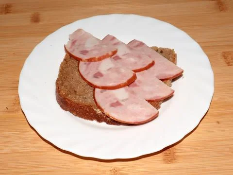 Ham on dark bread Stock Photos