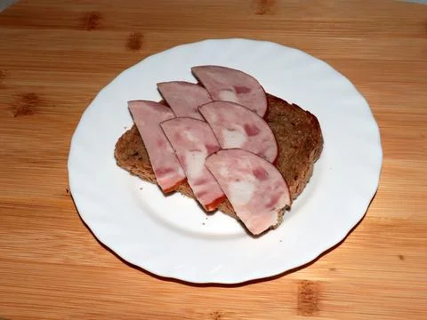 Ham on dark bread Stock Photos