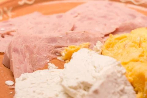 Ham eggs and cheese served on the plate Stock Photos