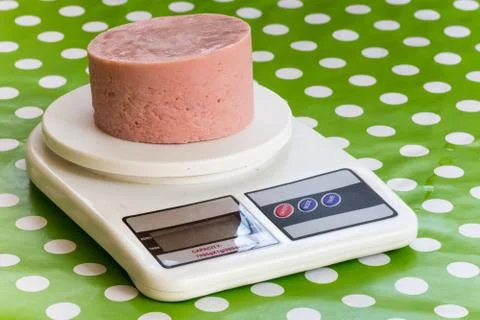 Ham on the kitchen digital scale Foto stock