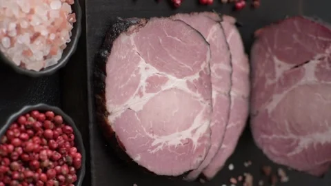 Ham, a meat cooked and sliced for sandwiches or Christmas table. Ham slices Stock Footage 317955056