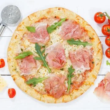 Ham pizza prosciutto square from above baking ingredients on wooden board Stock Photos