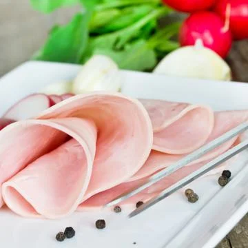 Ham on a plate Stock Photos