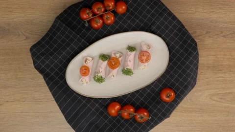 Ham rolls stuffed roll on a plate. Spinning. Close-up Video stock 163834168