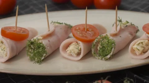 Ham rolls stuffed roll on a plate. Spinning. Close-up Stock Footage 163834209