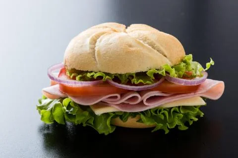 Ham sandwich on black table Stock Photos