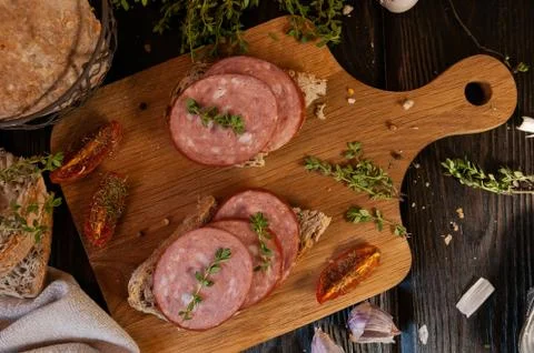 Ham sandwich, bread and sausage with herbs Stock Photos