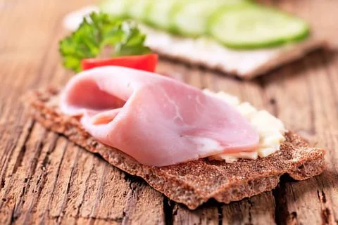 Ham sandwich on dark bread with cucumber Stock Photos