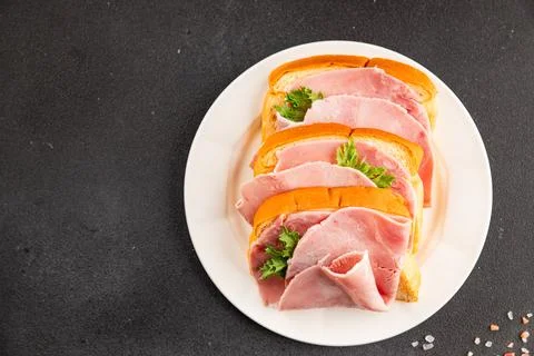 Ham sandwich slices of bread and pieces of ham fast food serving size natur.. Stock Photos