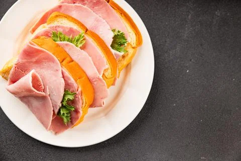 Ham sandwich slices of bread and pieces of ham fast food serving size natur.. Stock Photos